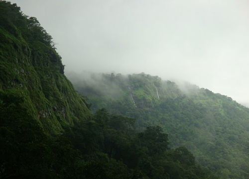 Monsoon clouds rolling over mountains